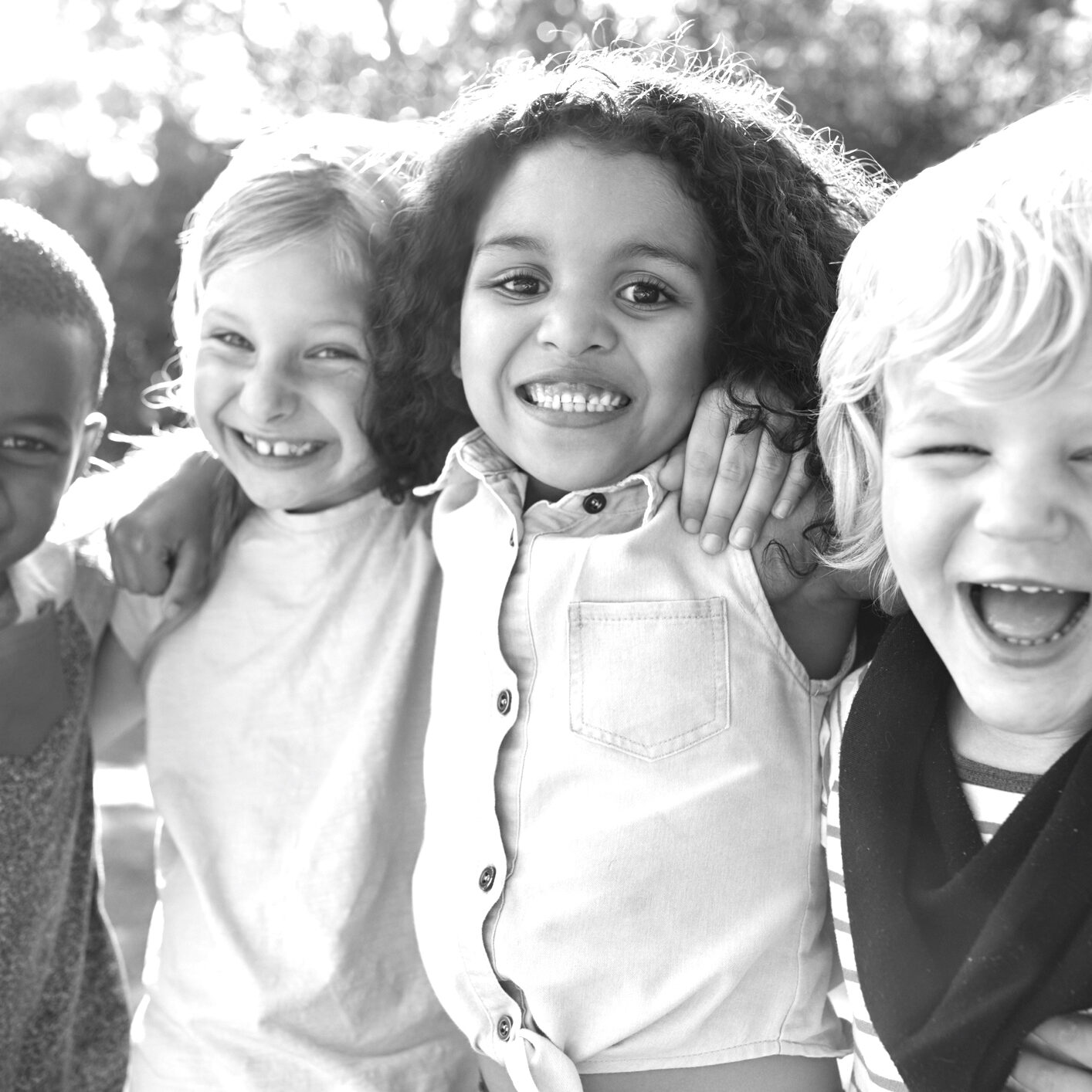 Four kids hanging out together in the garden